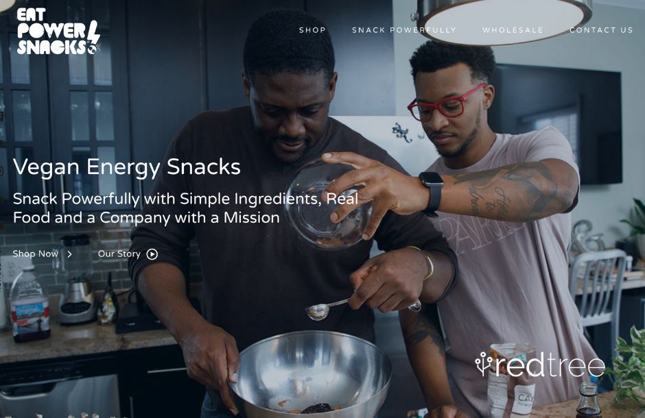 Two people pouring ingredients into a bowl with text over the photo that has the header "Vegan Energy Snacks" and text underneath it that says: "Snack Powerfully with Simple Ingredients, Real Food, and a Company with a Mission."