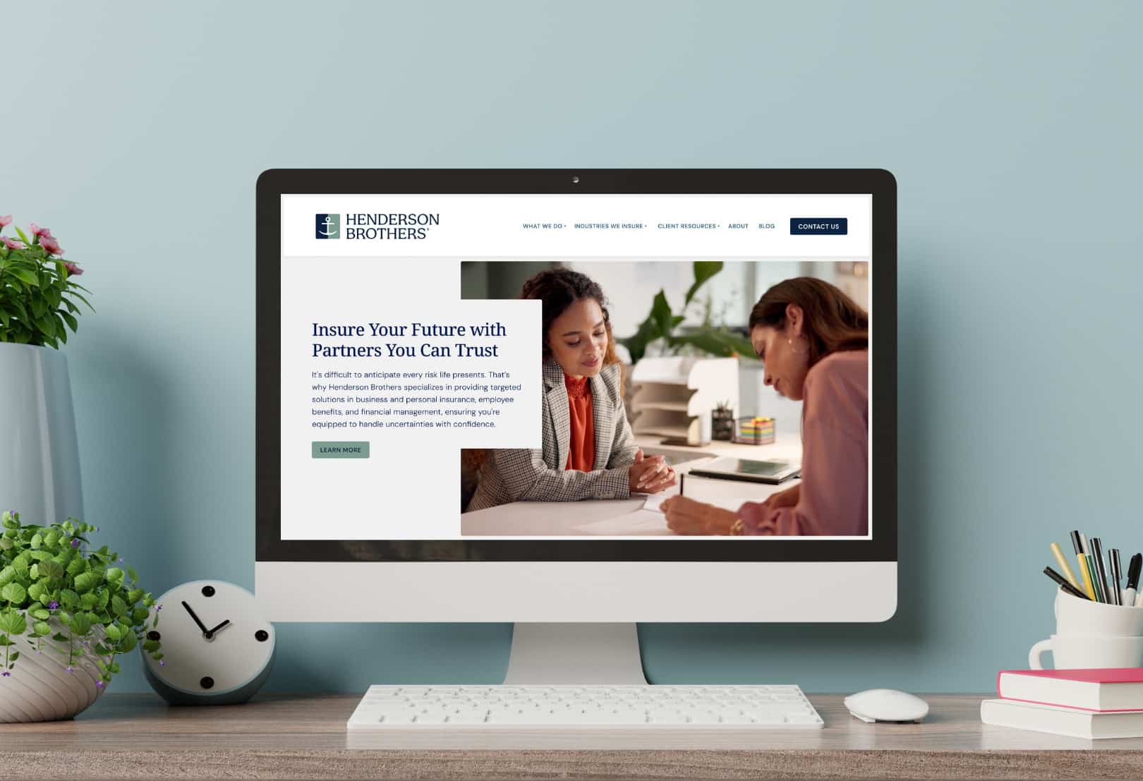 desktop computer displaying above the fold of the new Henderson Brothers website design